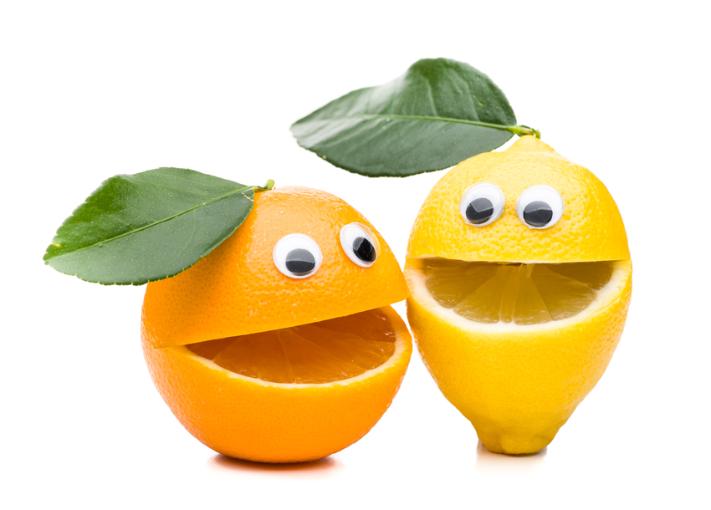Lustige Gesichter aus Orangen und Zitronen